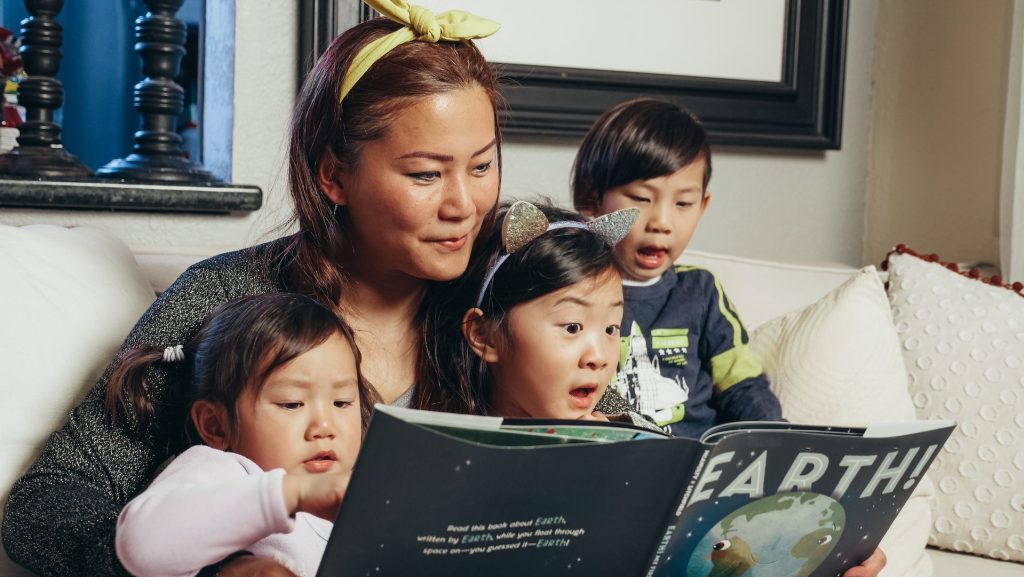 A mother improves her children's cultural literacy by reading to them.