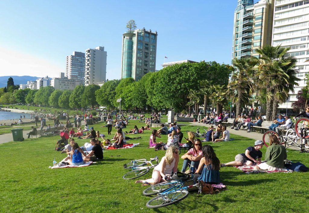 People at English Bay in the summer
