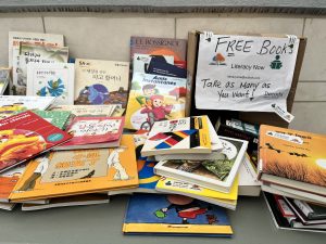 Literacy Now Burnaby table showcasing free books at the Brentwood Summer Social 2025