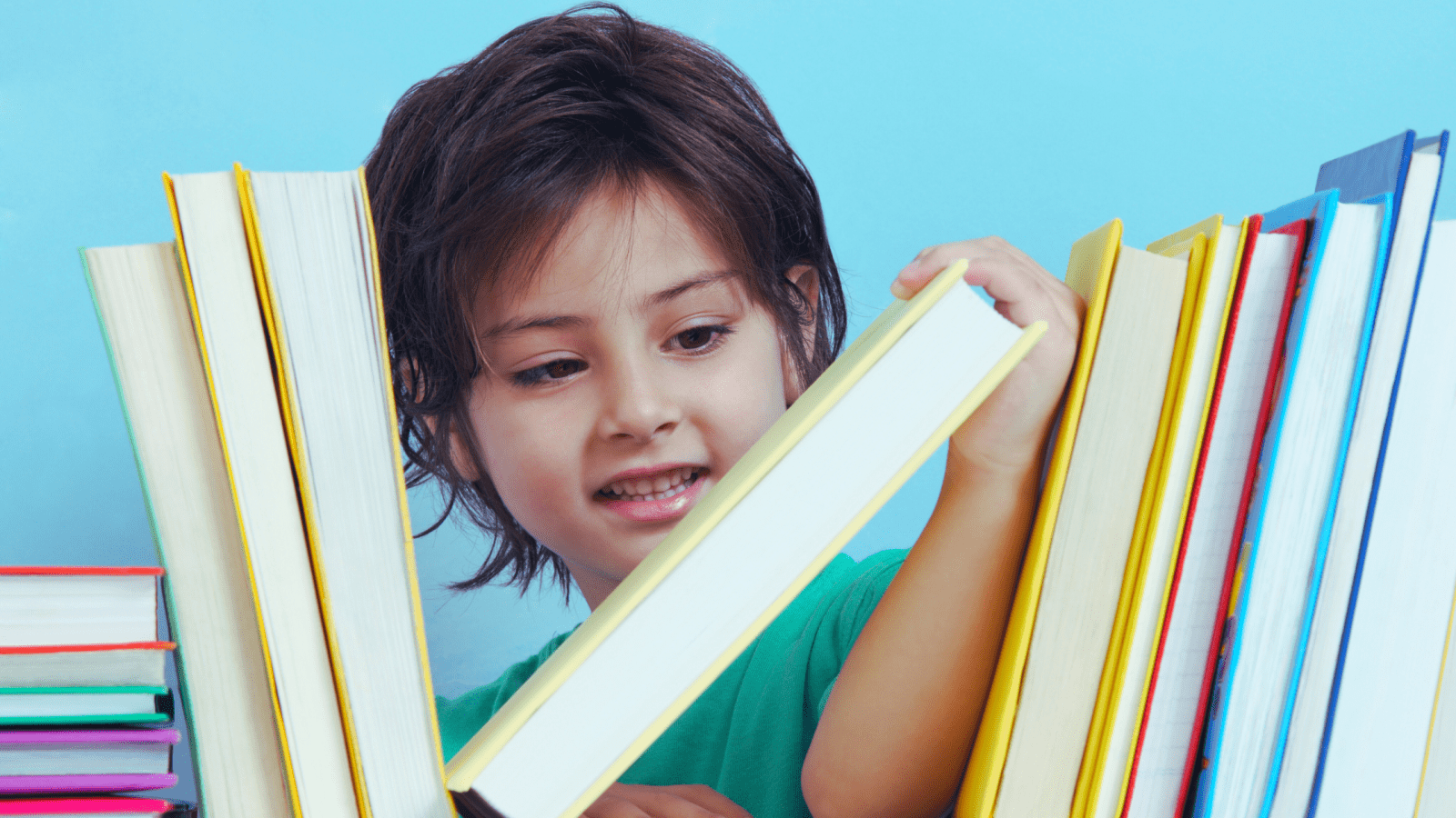 Kid curiously looking a yellow book in a bookshelf.