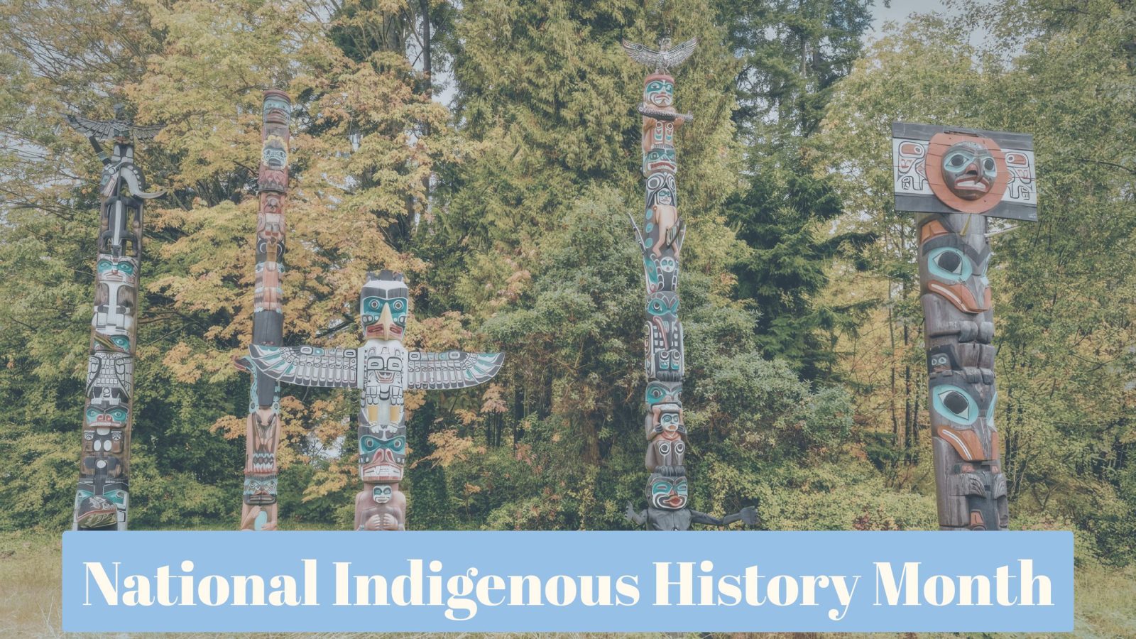 5 wooden totems in a forest. Representing indigenous culture.